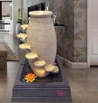 Modern Indoor Water Feature with Decorative Stones and Lighting