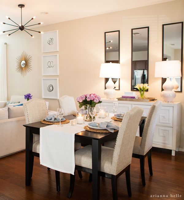 Contemporary Dining Room with Upholstered Chairs and Modern Lighting