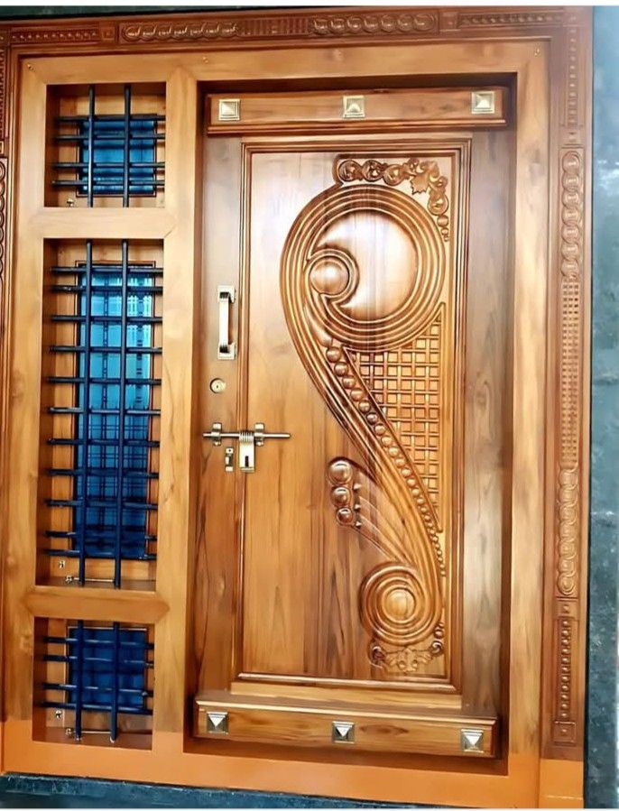 Ornate Wooden Entry Door with Geometric and Floral Carvings