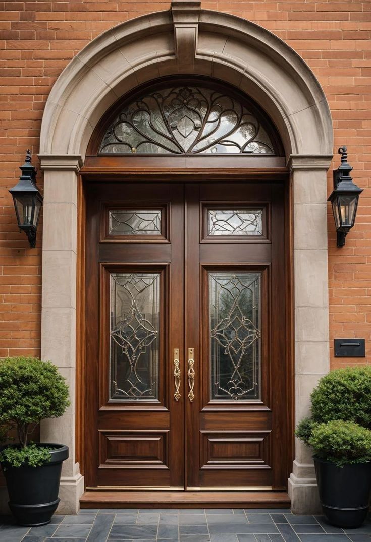 Traditional Double Wood Entry Door with Arched Transom and Brick Surround