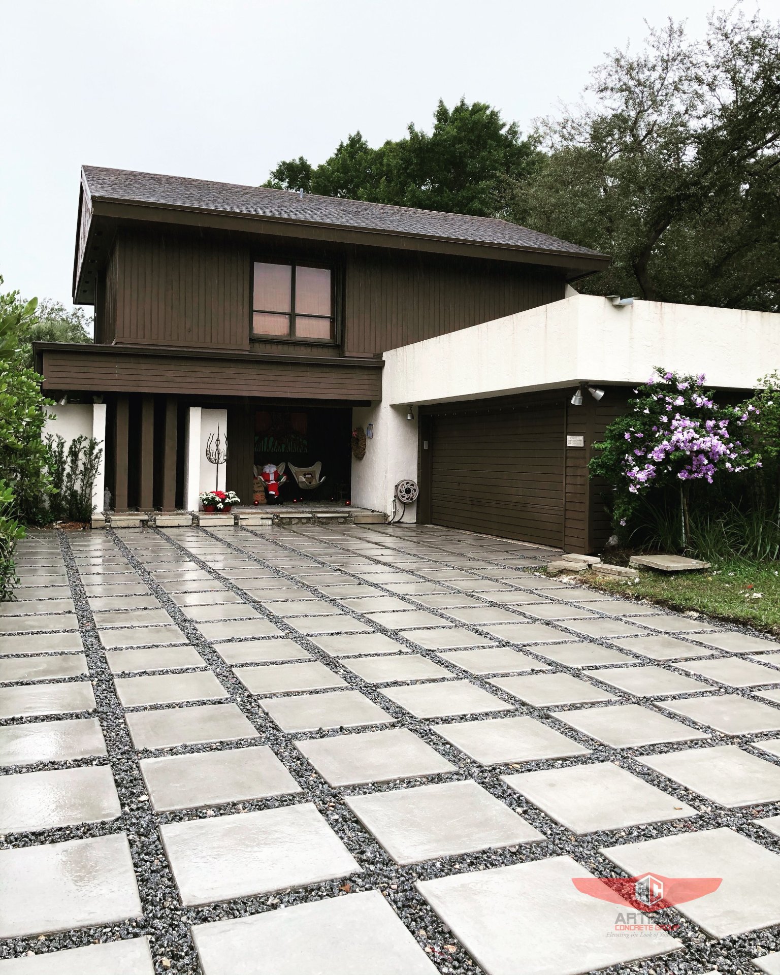 Modern home exterior with geometric concrete driveway