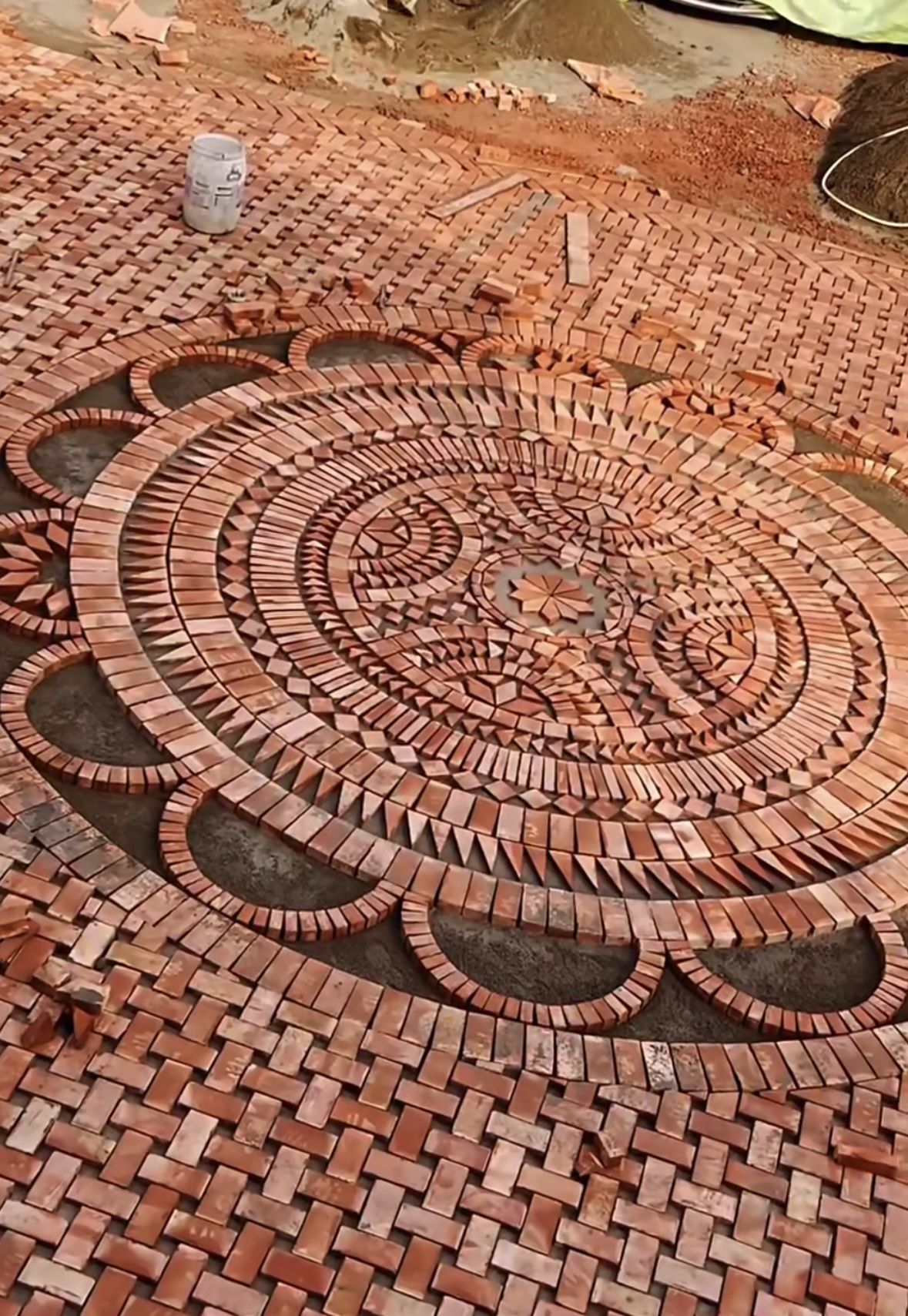 Intricate Circular Brick Patio Design With Geometric Patterns