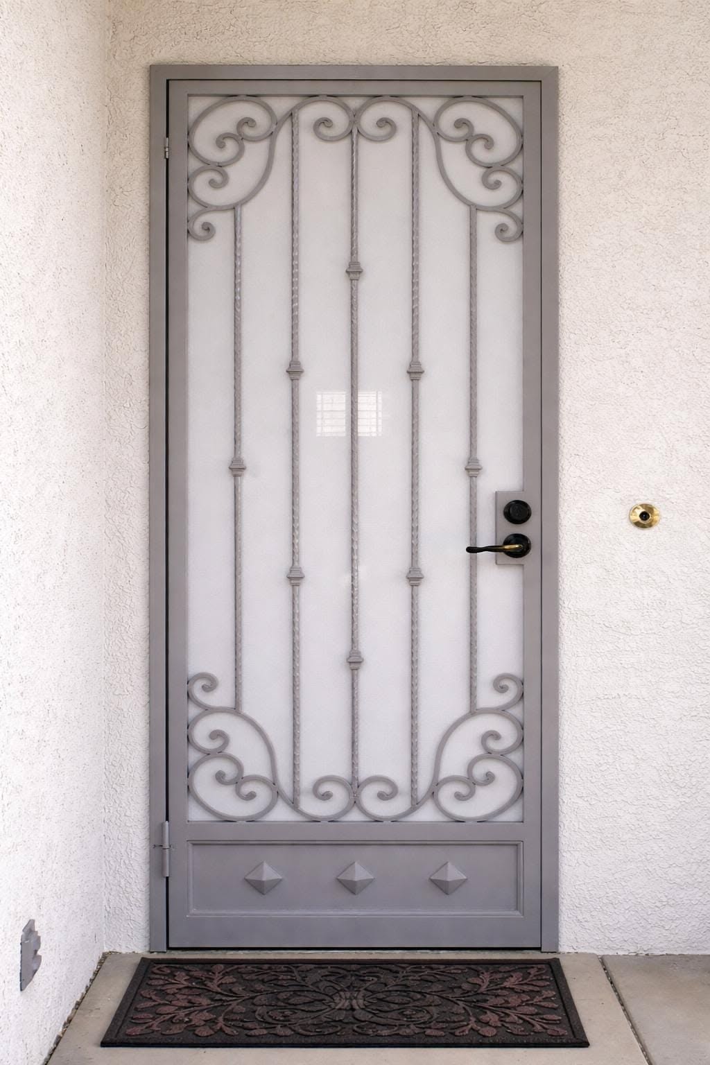 Decorative Gray Security Door with Ornamental Ironwork Entry