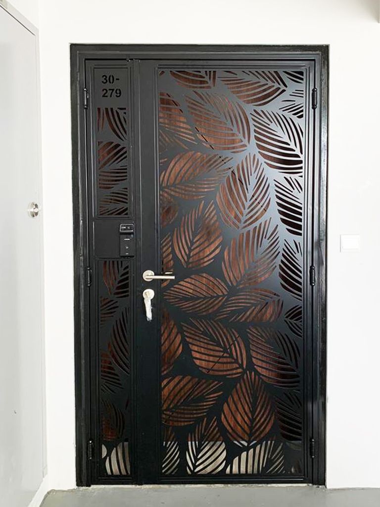 Modern Black Steel Entry Door with Leaf Pattern Cutouts
